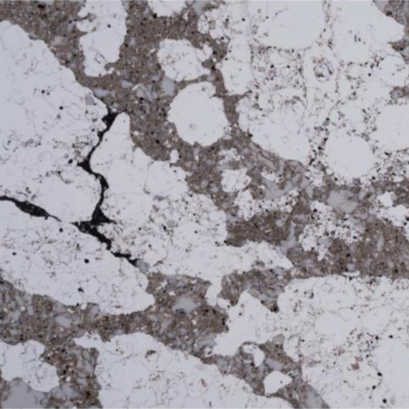 Mesa de quartzo sólido de cores diversas que parece mármore e granito